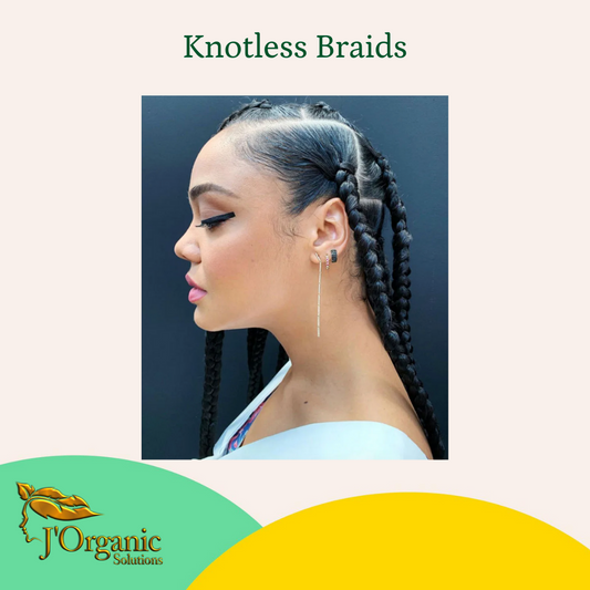 Woman with knotless braids hairstyle for natural summer hair care