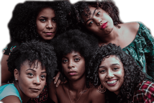 A diverse group of women proudly showcasing their natural hair textures, celebrating their beauty and individuality.