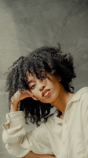 well-moisturized natural curls, emphasizing the importance of moisture in natural hair care.